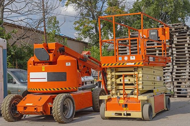 forklift maneuvering through a warehouse with stocked shelves in Anamosa, IA